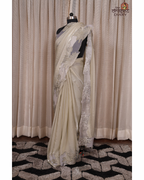 Ethereal Blooms – Soft Sage Cream Shimmer Tissue Saree